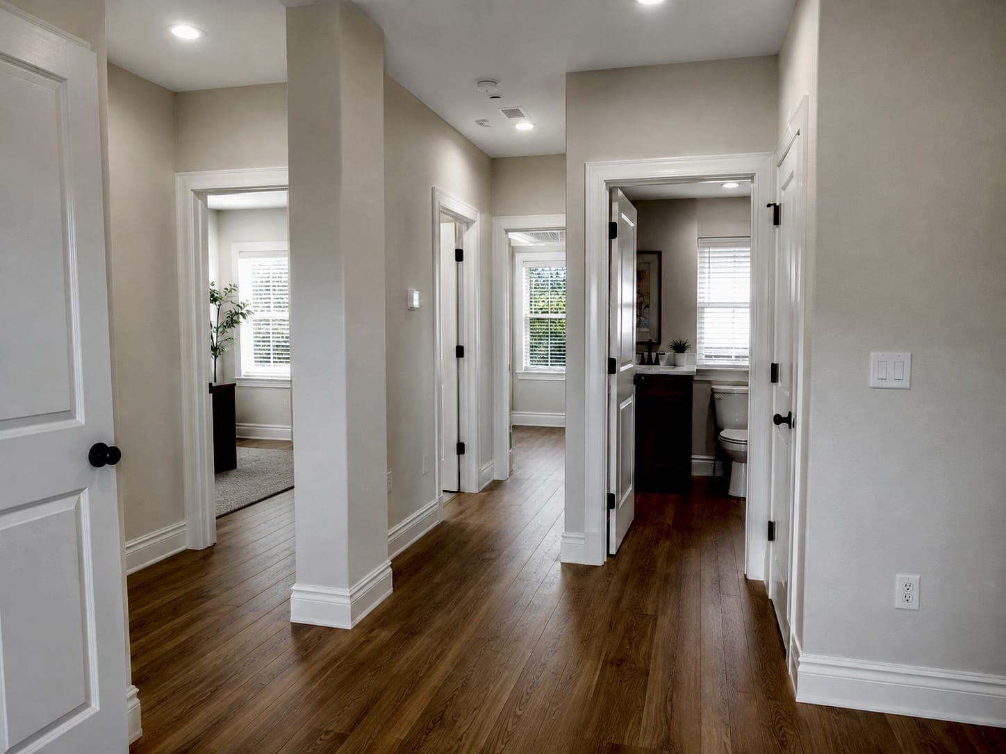 Restored apartment interior with new flooring, trim, doors and finished bathroom