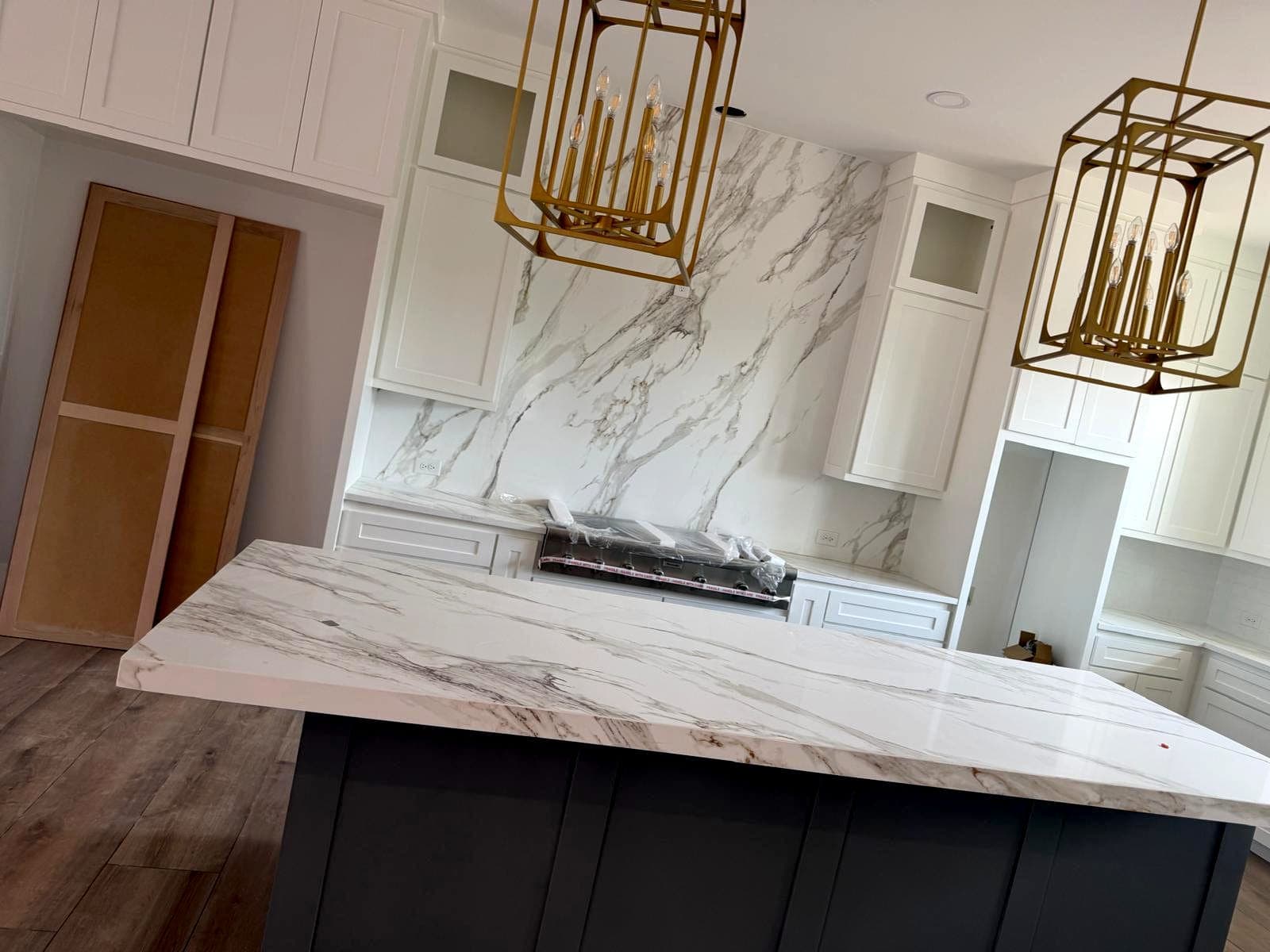 Island top and slab backsplash cut from matching stone