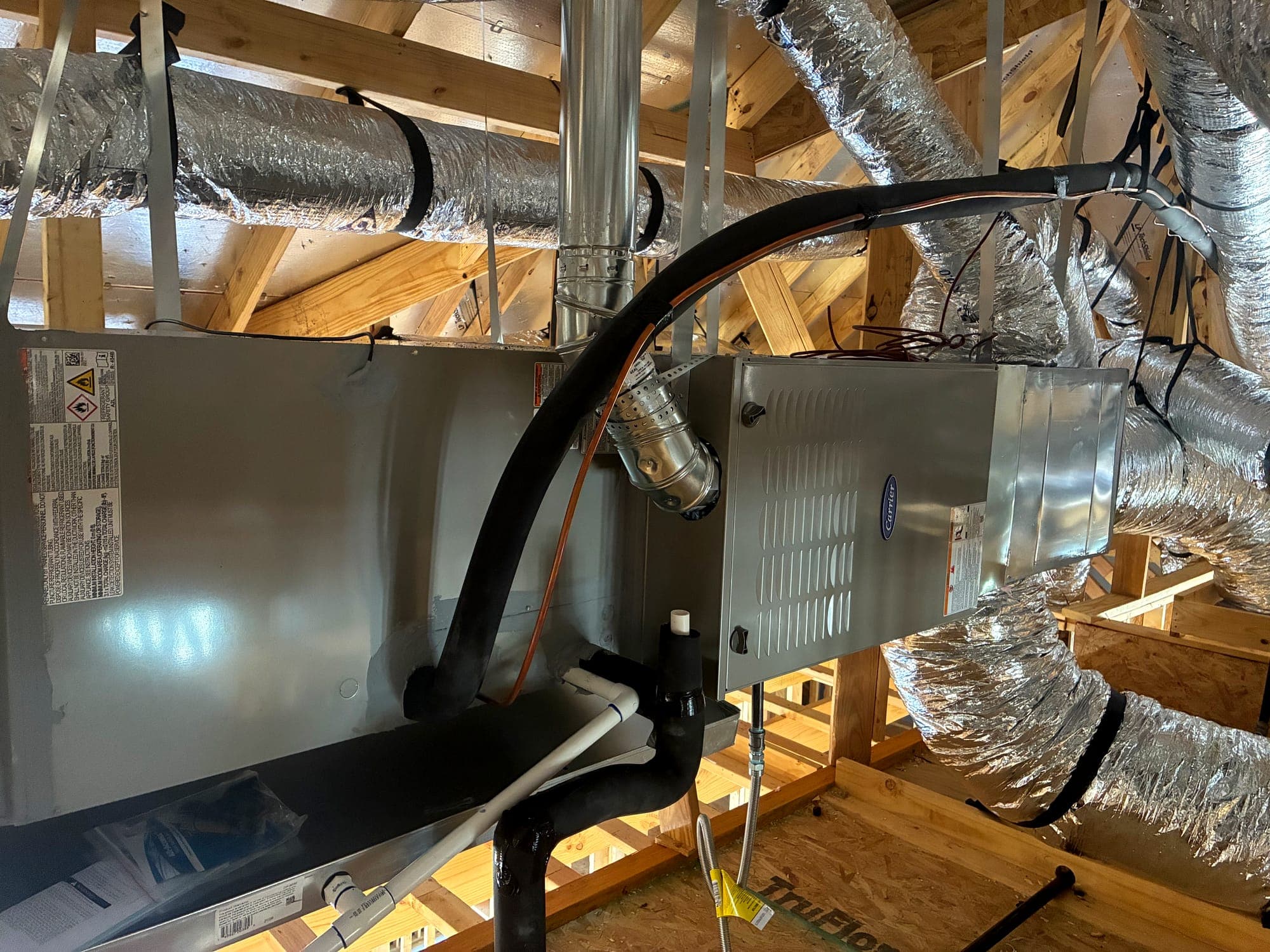 Air handler with condensate and refrigerant line set routed to the unit