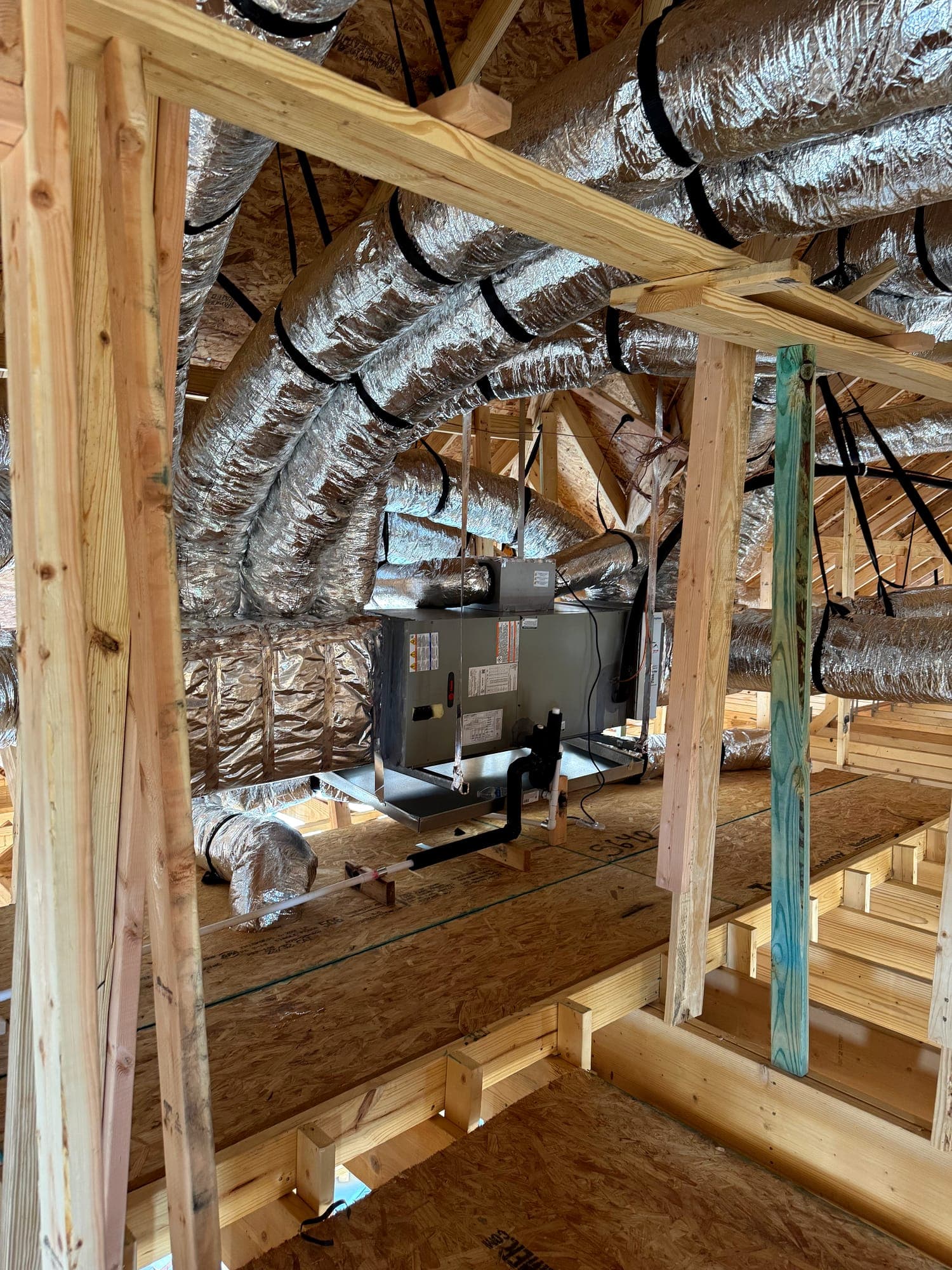 Attic air handler with trunk line and branch duct distribution