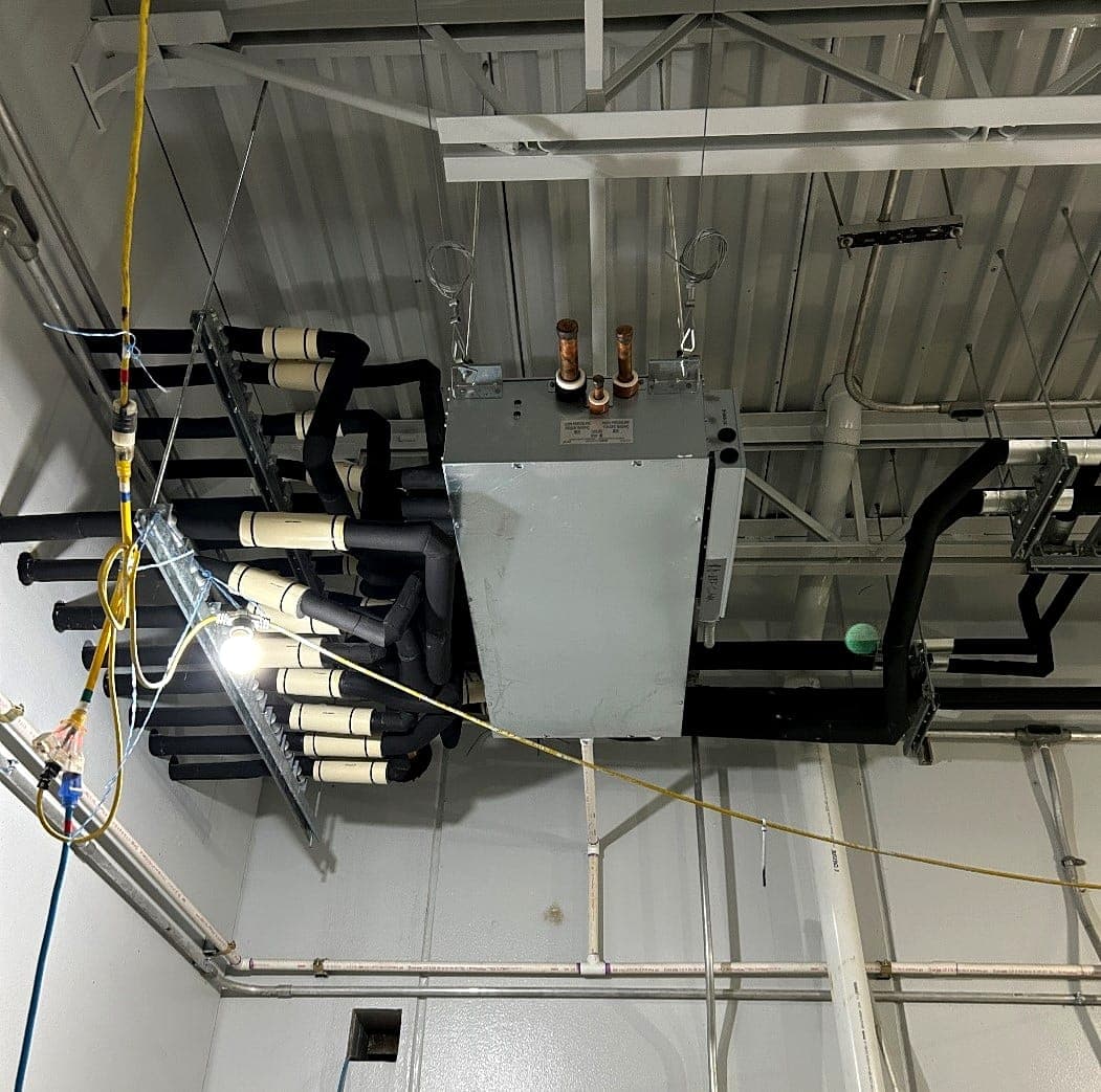 Overhead mechanical and electrical rough-in with conduit banks and equipment
