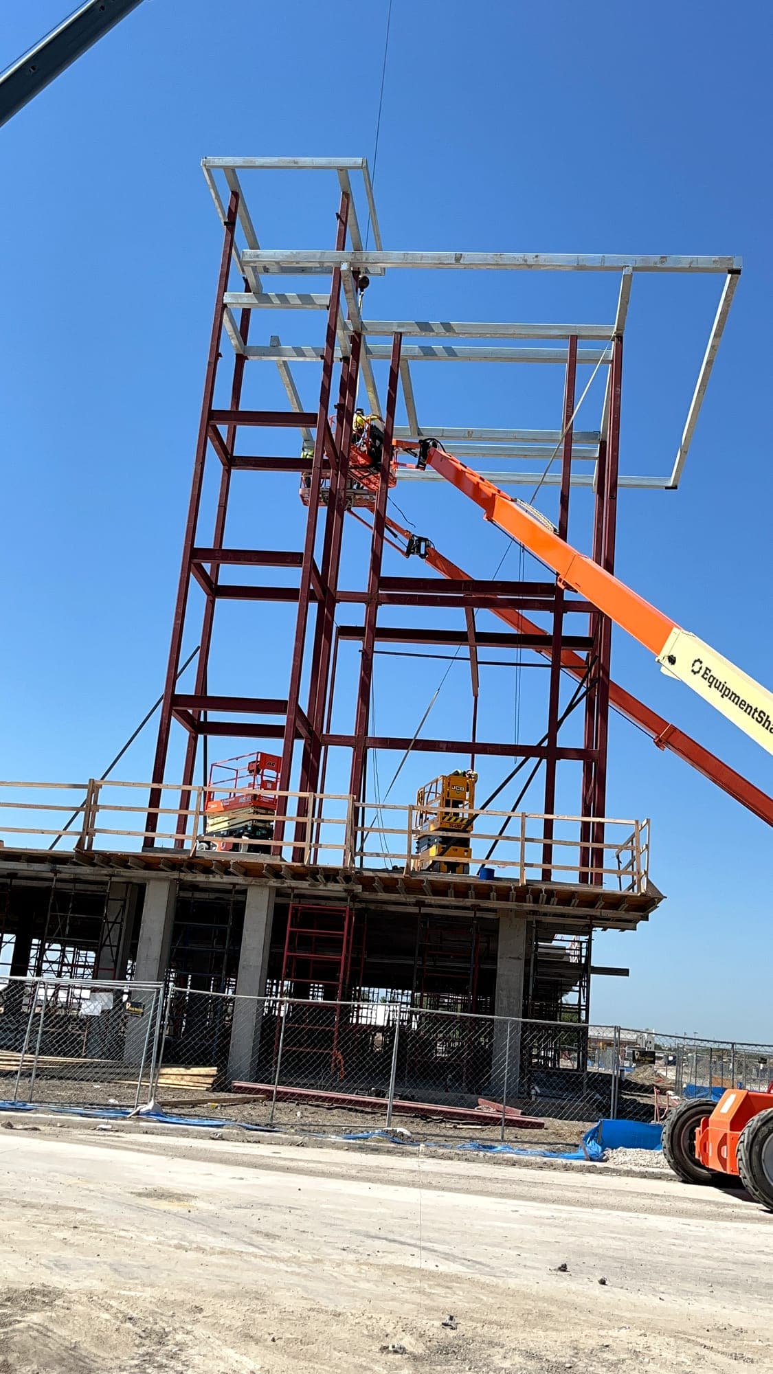 Steel framing set by crane on a multi-story structure