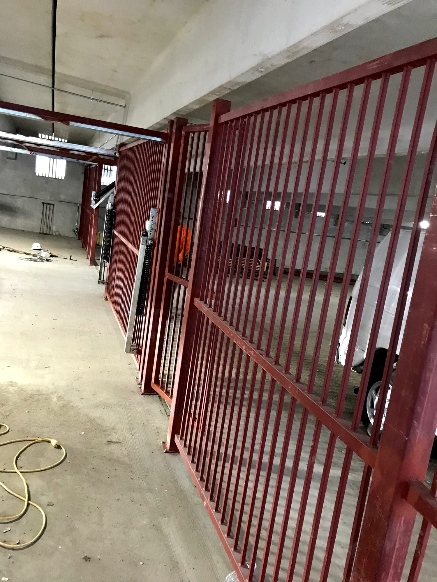 Steel picket screen framing installed at a parking structure opening