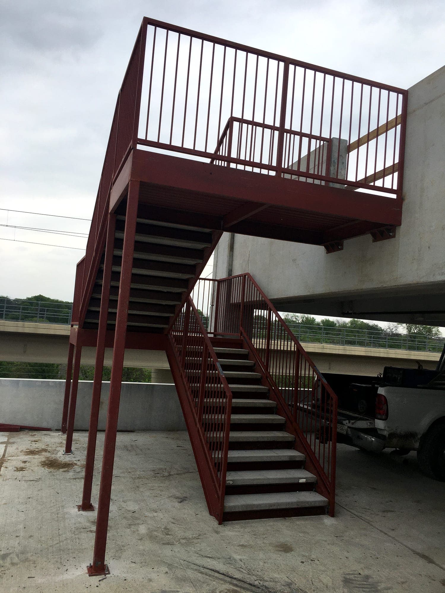 Fabricated steel stair, landing platform and guardrails at a commercial structure